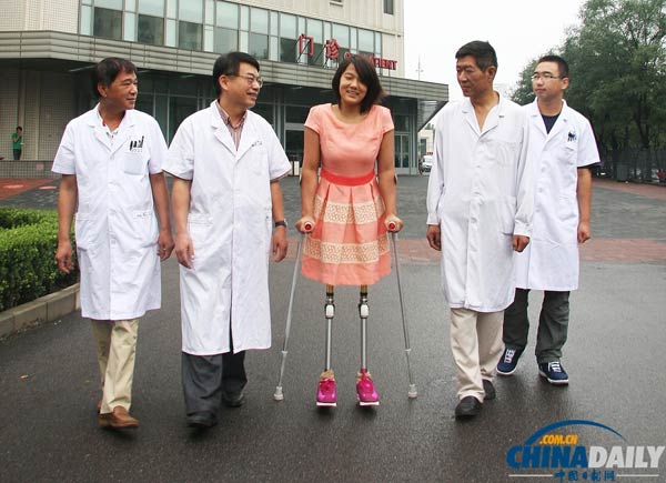 Qian's height increased to 1.64 meters after being fitted with new artificial limbs, Aug 30, 2013. [Photo/chinadaily.com.cn]  