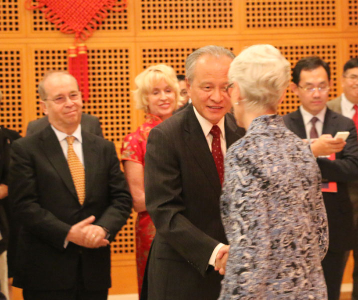 Chinese Ambassador to the US Cui Tiankai (center) shakes hands with US Under Secretary of State for Political Affairs Wendy Sherman (right) after Sherman spoke at a reception in the Chinese embassy in Washington on Monday evening to mark the 65th anniversary of the founding of the People's Republic of China. On the left is US Assistant Secretary of State for East Asian and Pacific Affairs Daniel Russel. Chen Weihua/China Daily