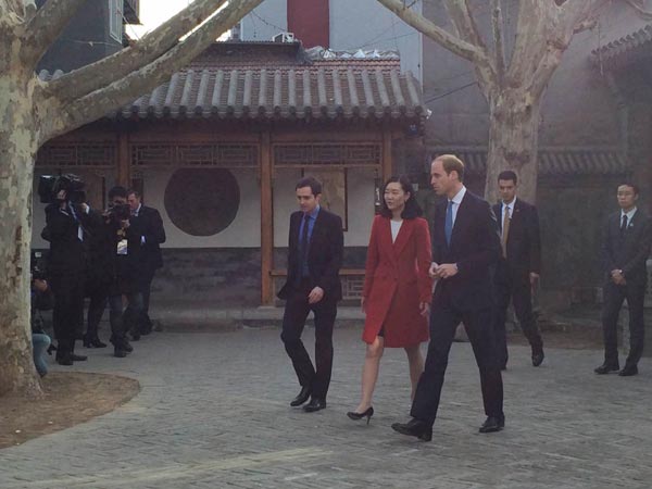 Britain's Duke of Cambridge, Prince William (R3) visits Shijia Hutong Museum in Beijing on March 2, 2015. (Photo: Chen Mengwei/For chinadaily.com.cn)