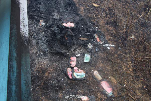 An armored car carrying large amounts of cash caught fire along Liuqin highway in the Guangxi Zhuang Autonomous Region on April 15, 2015. All 11 boxes of cash on board were burned to ashes; guards aboard the car attempted to put the flames out, but the fire extinguisher in the vehicle was expired and didn't work. (Photo/Weibo of CCTV)