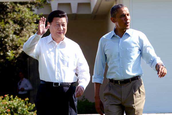 President Xi Jinping, left, and his US counterpart Barack Obama walk at the Annenberg Retreat of the Sunnylands estate in Rancho Mirage, California, June 2013. (Photo/Xinhua)