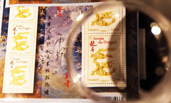 A close up view of stamps designed by Li Yaozhong for the Year of the Dragon. (Photo/Xinhua)