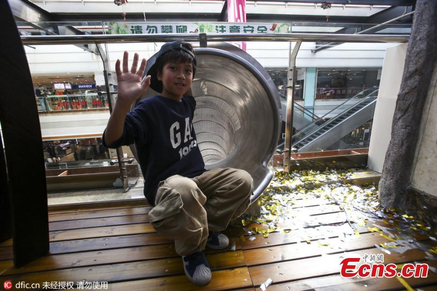 Sliding fun in shopping mall