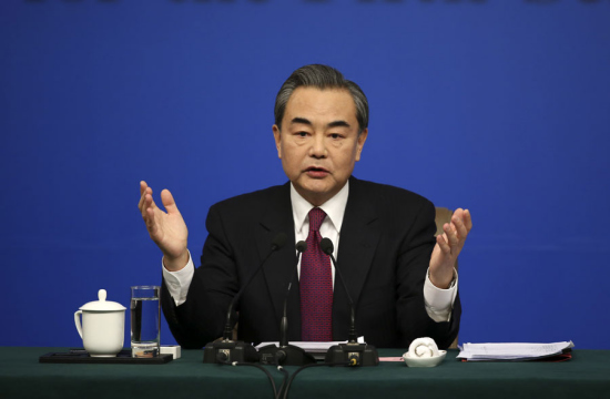 Wang Yi takes questions at a news conference on the sidelines of the national legislature annual session in Beijing on March 8, 2017. [Photo by Feng Yongbin/China Daily]