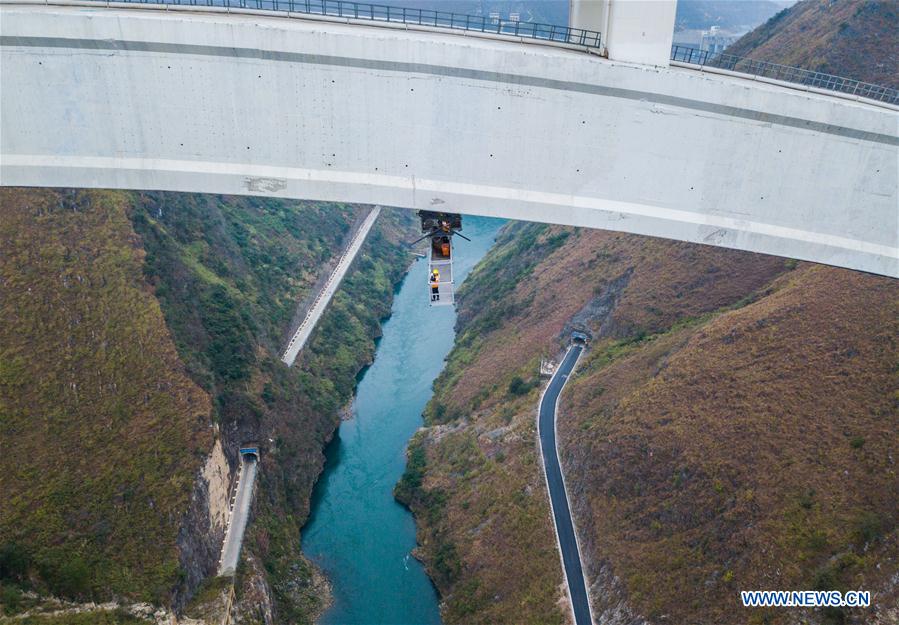 Workers examine railway bridge everyday for safety in Guizhou