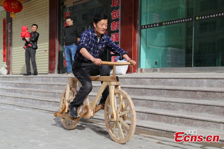 Farmer builds totally wooden bike