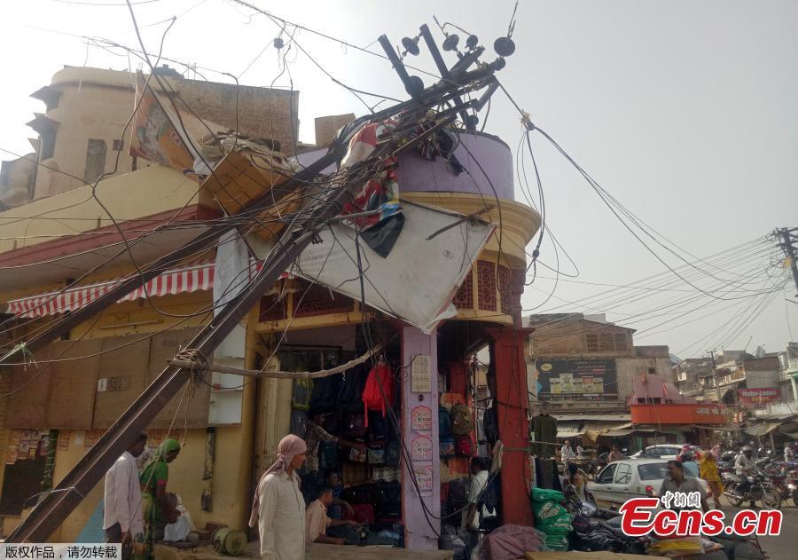 At least 125 killed as storms batter India