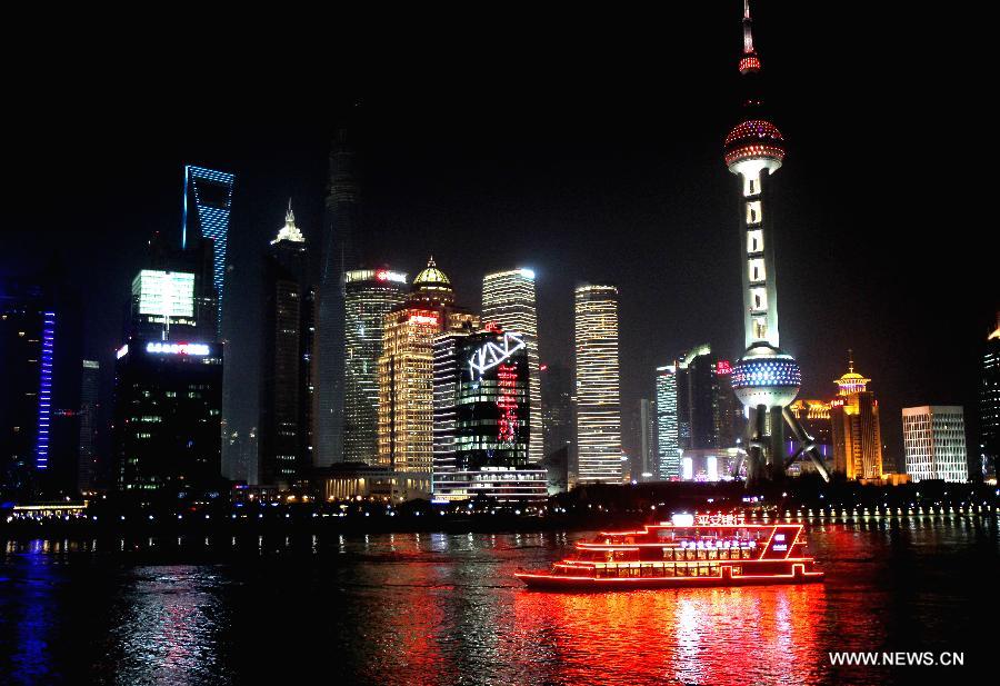 Photo taken on Jan 1, 2014 shows the building of China Financial Information Center (C) in Shanghai, east China. China Financial Information Center is located in the Lujiazui Financial and Trade Zone in Shanghai\'s Pudong and officially opened on Wednesday. (Xinhua/Liu Ying)