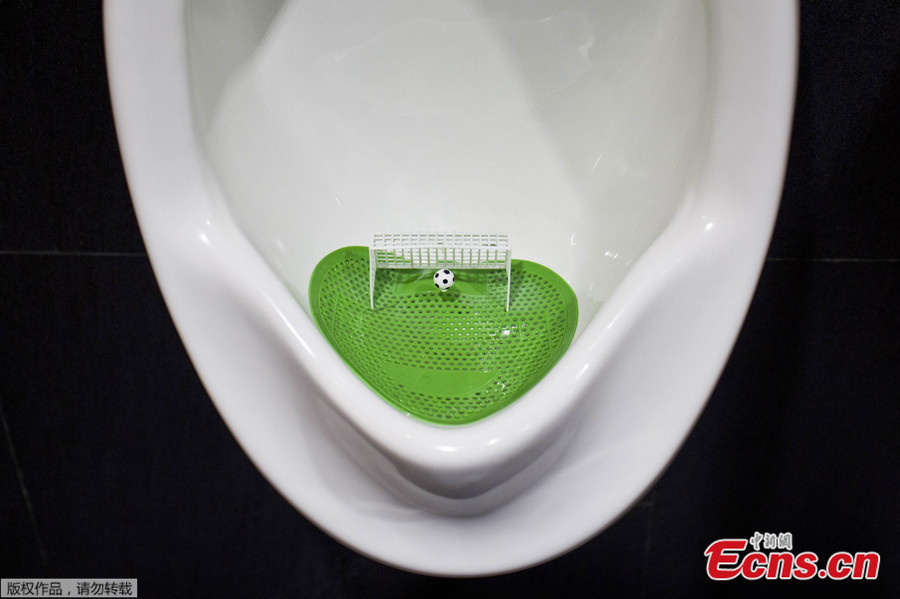 Mini soccer goals in urinals help improve men's aim (1/3) Headlines
