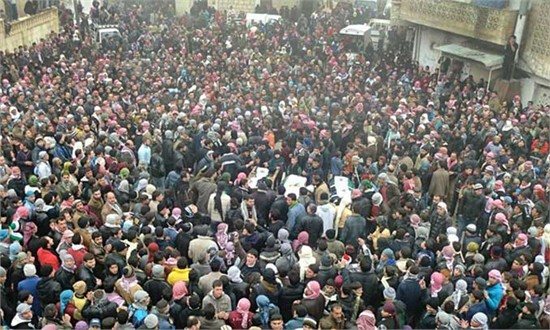 Mourners gather around the bodies of people allegedly killed by Syrian government forces, during a funeral procession in Maarat al-Noman, Idlib province, Syria, in this undated citizen journalism image accessed on Wednesday, Feb. 8, 2012. Photo: Courtesy 