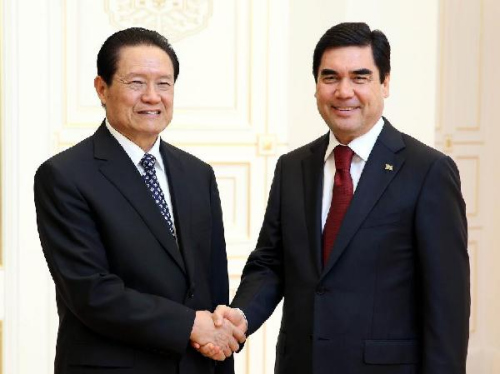 Zhou Yongkang (L), a member of the Standing Committee of the Political Bureau of the Communist Party of China (CPC) Central Committee, meets with Turkmenistan's President Gurbanguly Berdymukhamedov in Ashgabat, Turkmenistan, Sept. 24, 2012. (Xinhua/Yao Dawei)