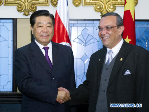 Jia Qinglin (L), chairman of the National Committee of the Chinese People's Political Consultative Conference (CPPCC), meets with Costa Rican Legislative Assembly President Victor Emilio Granados in San Jose, Costa Rica, Dec. 4, 2012. (Xinhua/Li Xueren)