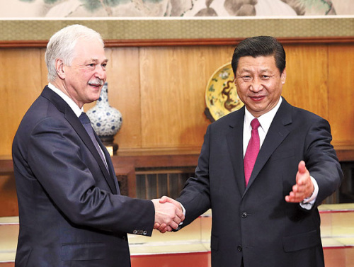 Party chief Xi Jinping greets Boris Gryzlov, chairman of the United Russia partys supreme council, in Beijing on Wednesday. Xi highlighted the importance of further developing ties as he met a number of political leaders from Russia. Photo by Wu Zhiyi / China Daily