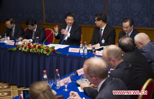Chinese President Xi Jinping (3rd L) meets with Russian sinologists, Chinese-learning students and representatives from the press in Moscow, capital of Russia, March 23, 2013. (Xinhua/Huang Jingwen)