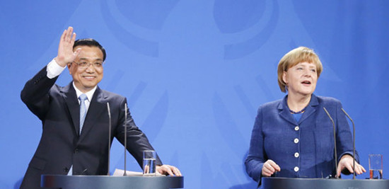 Premier Li Keqiang and German Chancellor Angela Merkel address a news conference after talks in Berlin on Sunday. Tobias Schwarz / REUTERS
