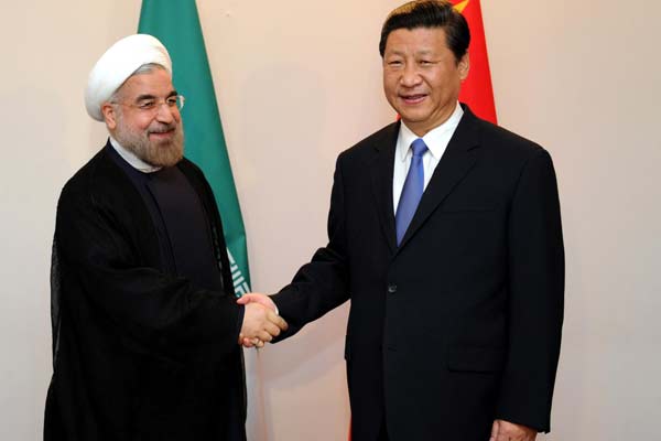 President Xi Jinping meets with his Iranian counterpart Hassan Rouhani in Bishkek, capital of Kyrgyzstan, on Thursday. Xi said he supports Iran's proposal for renewed negotiations on its nuclear program and its peaceful use of nuclear energy.[xie huanchi / xinhua]