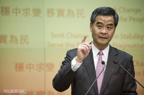 Hong Kong Chief Executive Leung Chun-Ying speaks to Journalist at a press conference after he delivered his 2013 Policy Address in Hong Kong, south China, Jan. 16, 2013. Leung delivered his first policy address on Wednesday morning at the Legislative Council here, outlining the city government's policy direction in 2013. (Xinhua/Lui Siu Wai)