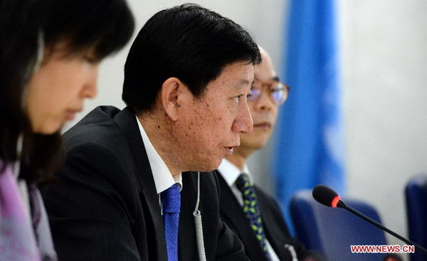Wu Haitao (C), deputy head of the Chinese delegation, speaks during the 17th session of the Human Rights Council's Universal Periodic Review (UPR) Working Group in Geneva on Oct 25, 2013. The report of the second round of the UPR on China was adopted on Friday by the Working Group on the UPR of the HRC. [Photo / Xinhua] 