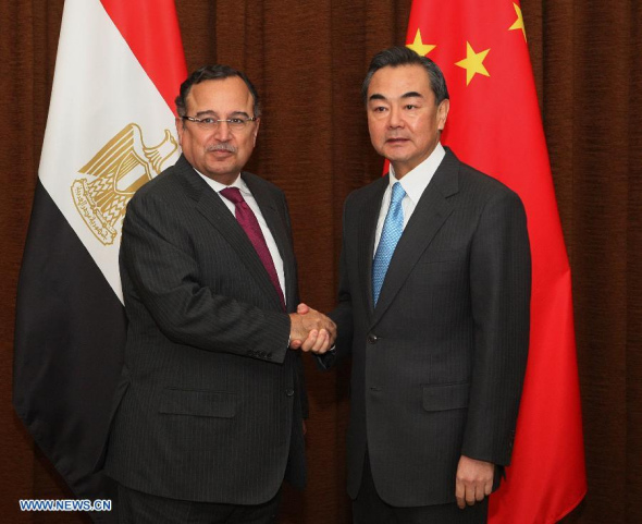 Chinese Foreign Minister Wang Yi (R) holds talks with his Egyptian counterpart Nabil Fahmy in Beijing, capital of China, Dec. 16, 2013. (Xinhua) 
