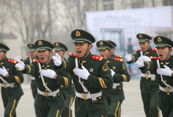 Officers from the Beijing Armed Police Corps undergo training on Friday. The officers will be responsible for security operations during the upcoming CPC and CPPCC sessions. LI GUANGYIN / FOR CHINA DAILY