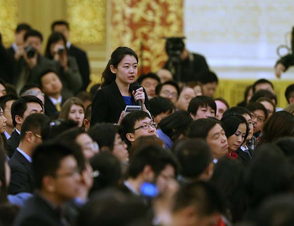 China Daily journalist Zhao Yinan poses a question to Premier Li Keqiang on Thursday. Feng Yongbin / China Daily
