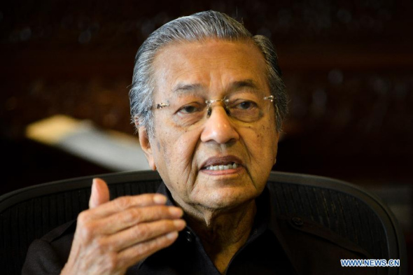Former Malaysian Prime Minister Mahathir Mohamad speaks during an exclusive interview with Xinhua News Agency in Kuala Lumpur, Malaysia, on Aug 18, 2014. (Xinhua/Chong Voon Chung)