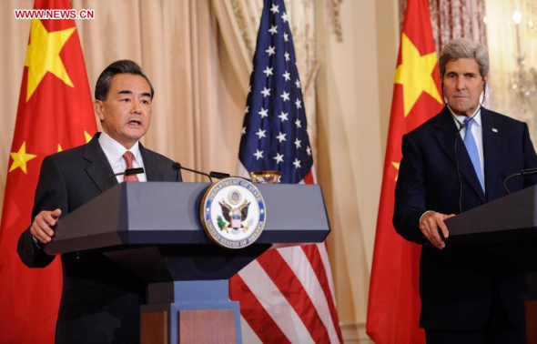 Chinese Foreign Minister Wang Yi (L) addresses the press in Washington D.C. , the United States, on Oct. 1, 2014. Hong Kong affairs are China's internal affairs and all countries should respect China's sovereignty, Chinese Foreign Minister Wang Yi said on Wednesday. (Xinhua/Bao Dandan)