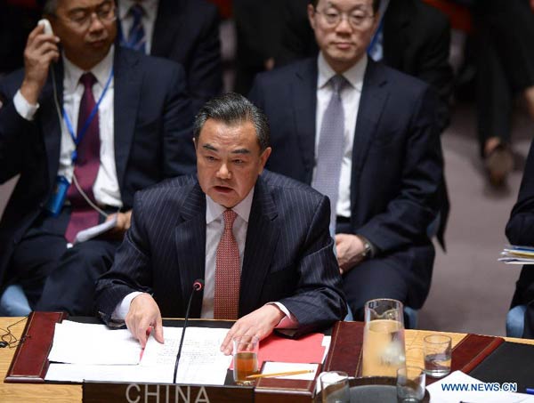 Chinese Foreign Minister Wang Yi attends a UN Security Council summit on terrorism in New York, Sept 24, 2014. Wang Yi on Wednesday called on the international community to come up with new thinking and new steps in its response to terrorism. [Photo/Xinhua]  