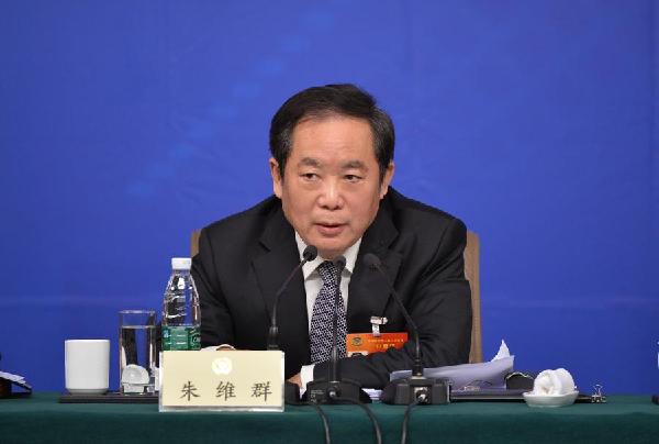 Zhu Weiqun, head of the Ethnic and Religious Affairs Committee of the National Committee of the Chinese People's Political Consultative Conference (CPPCC), answers questions from journalists at a press conference in Beijing, March 11, 2015. (Photo/Xinhua)