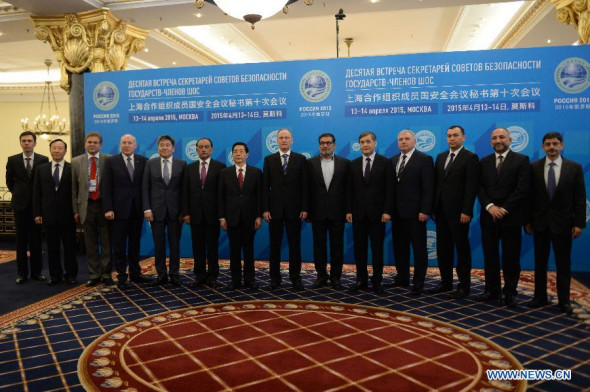Chinese State Councilor Guo Shengkun (7th L) and other representatives pose for group photos during the 10th meeting of the Shanghai Cooperation Organization (SCO) security council secretaries in Moscow, Russia, April 14, 2015. China is willing to coordinate with all parties and strengthen the cooperation on law enforcement security under the framework of SCO, visiting Chinese State Councilor Guo Shengkun said Tuesday. (Photo/Xinhua) 