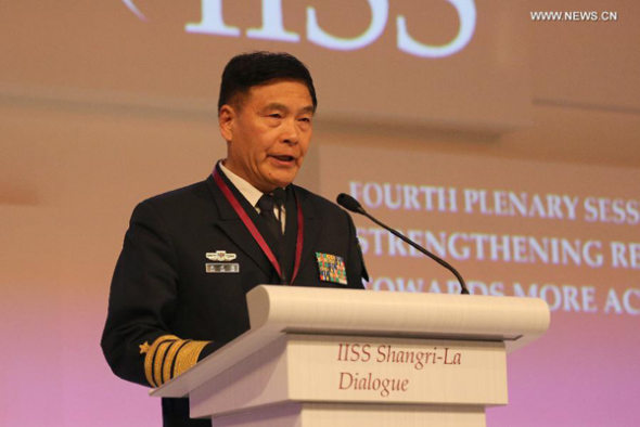 Admiral Sun Jianguo, deputy chief of staff of China's People's Liberation Army (PLA) addresses the fourth plenary session of the Shangri-La Dialogue in Singapore, May 31, 2015. Sun Jianguo elaborated on China's foreign and defense policies. (Photo:Xinhua/Bao Xuelin)