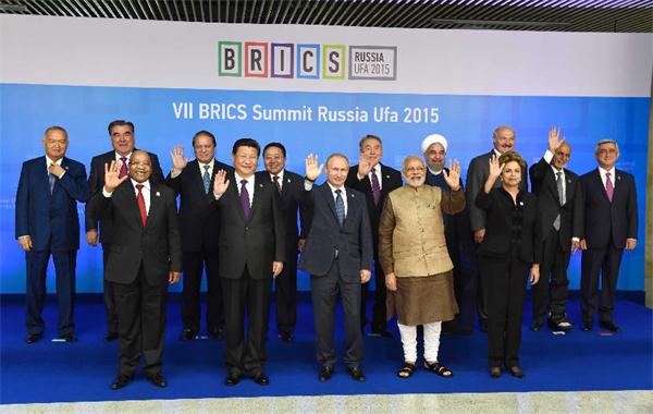 Chinese President Xi Jinping poses for photos with leaders of the Shanghai Cooperation Organization (SCO) members and observers, the Eurasian Economic Union (EEU) leaders, leaders of invited countries and the BRICS nations, namely Brazil, Russia, India, China and South Africa in Ufa, Russia, July 9, 2015. (Xinhua/Rao Aimin)