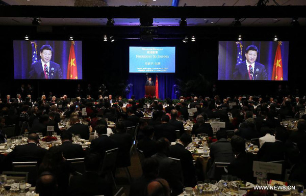 Chinese President Xi Jinping (C) delivers a speech during a welcome banquet jointly hosted by Washington State government and friendly communities in Seattle, the United States, Sept. 22, 2015. Xi arrived in this east Pacific coast city on Tuesday morning for his first state visit to the U.S. (Xinhua)
