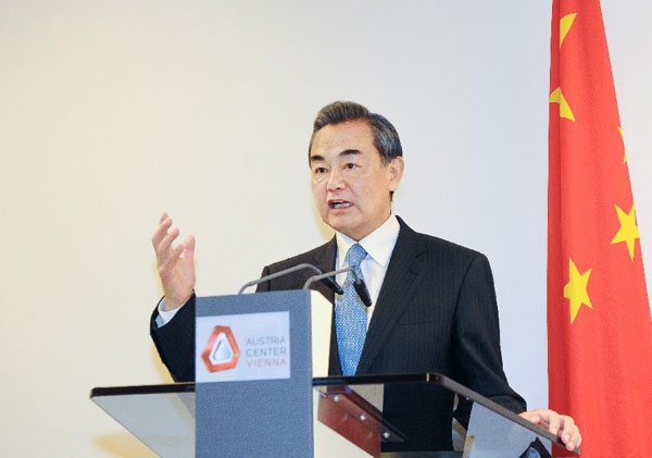 Chinese Foreign Minister Wang Yi is interviewed by media in Vienna, Austria, on July 14, 2015.(Photo/Xinhua)