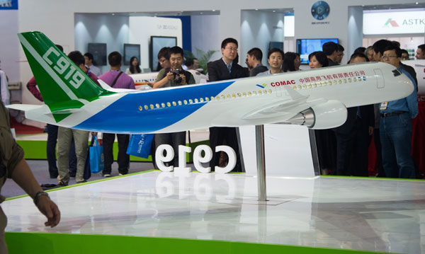 A model of the C919 jet is displayed at Airshow China 2014 in Zhuhai, Guangdong province, in November. (Photo/China Daily)