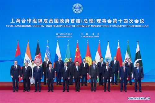 Chinese Premier Li Keqiang (6th L, front) poses for a group photo with other participants of the 14th prime ministers' meeting of the Shanghai Cooperation Organization (SCO) in Zhengzhou, capital of central China's Henan Province, Dec. 15, 2015. (Xinhua/Wang Ye)