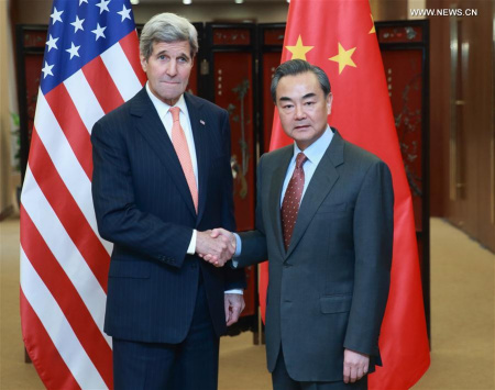 Chinese Foreign Minister Wang Yi (R) shakes hands with U.S. Secretary of State John Kerry in Beijing, capital of China, Jan. 27, 2016. (Photo: Xinhua/Ding Haitao)