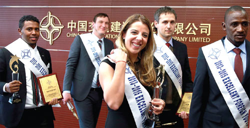 Savanah Oliveira Kunz (center), from Brazil, is one of the 10 excellent overseas employees of China Communications Construction Company. (Photo by Zou Hong / China Daily)