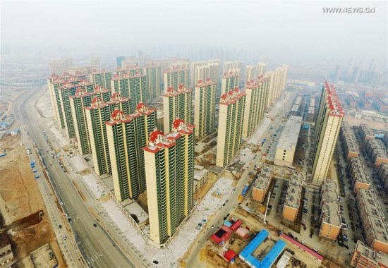 Photo taken on Feb. 25, 2016 shows a cluster of residential buildings for sale in Shijiazhuang, capital of north China's Hebei Province.  (Photo: Xinhua/Zhu Xudong)
