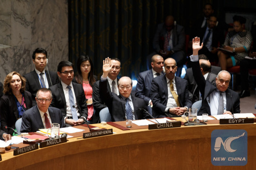 Liu Jieyi (C, front), China's permanent representative to the United Nations, votes on a resolution on the Democratic People's Republic of Korea (DPRK), at the UN headquarters in New York, the United States, March 2, 2016. The UN Security Council adopted a resolution on Wednesday to impose sanctions on the DPRK in order to curb the country's nuclear and missile programs. (Photo: Xinhua/Li Muzi)