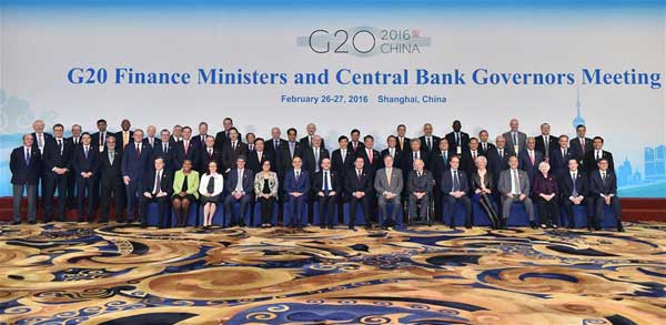 Officials pose for a family photo at the G20 Finance Ministers and Central Bank Governors Meeting at the Pudong Shangri-la Hotel in Shanghai, East China, Feb 27, 2016. (Photo/Xinhua)