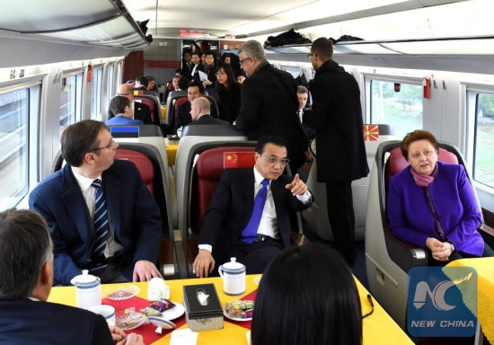 Chinese Premier Li Keqiang (2nd L, 2nd row) invites leaders attending the fourth China and Central and Eastern European (CEE) countries leaders' meeting to a ride on a China-made bullet train from Suzhou to Shanghai, Nov. 25, 2015. (Photo: Xinhua/Rao Aimin)