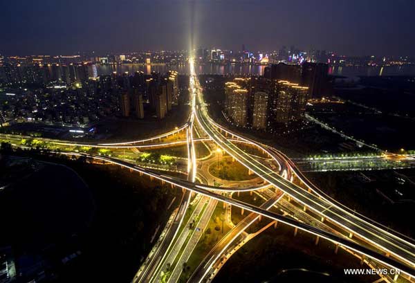 File photo taken on May 24, 2016 shows an aerial view of expressways linking Hangzhou Xiaoshan International Airport at night in Hangzhou, East China's Zhejiang province. Hangzhou is the host city for the 2016 G20 summit on Sept 4 and Sept 5. With one month to go, Hangzhou looks forward to G20. (Photo/Xinhua)