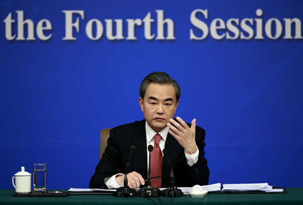 Chinese Foreign Minister Wang Yi takes questions from the press during a news conference on the sidelines of the two sessions on Tuesday. (Photo by Feng Yongbin/chinadaily.com.cn)
