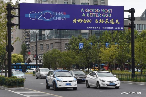 Cars move on a street in Hangzhou, capital of east China's Zhejiang Province, Aug. 27, 2016. The 11th G20 summit will be held from Sept. 4 to 5 in Hangzhou. (Photo: Xinhua/Ju Huanzong) 