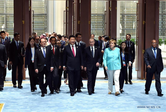 Chinese President Xi Jinping and other leaders of the Group of 20 (G20) members, some guest countries and international organizations walk into the venue of the G20 summit in Hangzhou, capital of east China's Zhejiang Province, Sept. 4, 2016. (Photo: Xinhua/Li Tao)