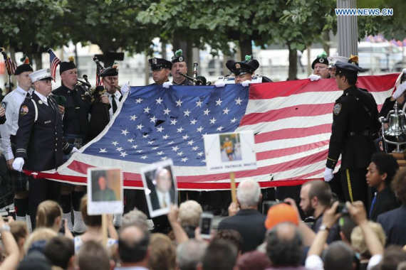 A national flag of the United Staes is displayed at a ceremony marking the 15th anniversary of September 11 attacks at the National 9/11 Memorial, in New York, the United States, on Sept. 11, 2016.  (Photo: Xinhua/Wang Ying)