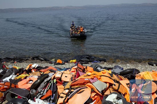 Migrants arrive on the shores of the Greek island of Lesbos after crossing the Aegean Sea from Turkey on a dinghy on September 10, 2015. (Photo/Xinhua)