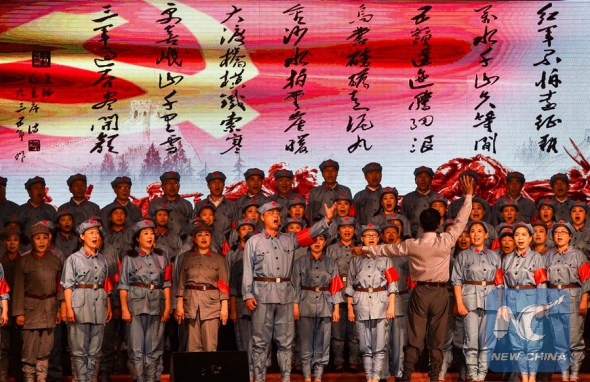 Performers sing the song Long March in chorus during a song and dance performance commemorating the 80th anniversary of the end of Red Army's Long March, a 12,500-km forced expedition that made history,in Jilin, northeast China's Jilin Province, Aug. 24, 2016. (Photo: Xinhua/Xu Chang)
