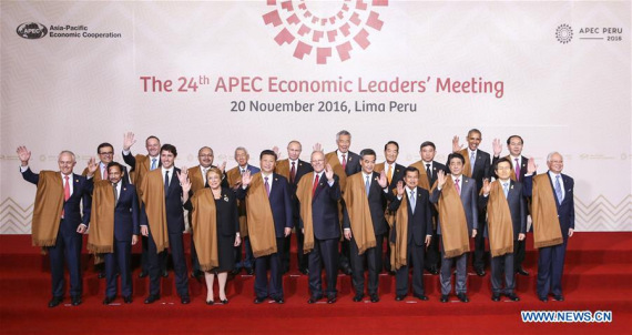 Chinese President Xi Jinping (5th L F) poses for a group photo with other participants of the 24th APEC Economic Leaders' Meeting in Lima, Peru, Nov. 20, 2016. (Photo: Xinhua/Ding Lin)